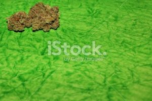 Cannabis on a green background horizontal